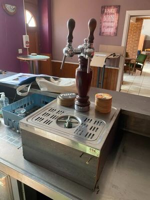 an image of a kitchen with a sink and a coffee machine