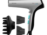 a close up of a hair dryer and comb on a white background