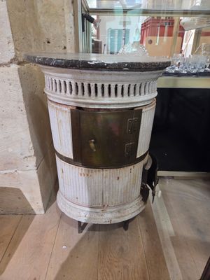 a small stove sitting on a wooden floor in a room