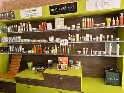 many different types of skin care products displayed on the shelves