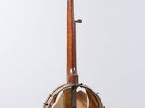 an old banjo is hanging from a wooden pole on a white background
