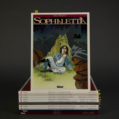 books stacked on top of each other on a black surface