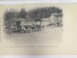 a black and white photo of a group of people riding horses
