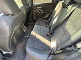 the back seats of a car are empty in the back of the car