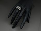 a close up of a person ' s hand with a ring on it ' s finger