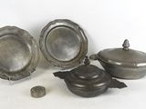 three silver plated dishes and a bowl on a white surface