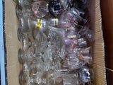 a cardboard box full of empty plastic bottles and a yellow object