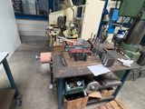 a table with a lot of tools on it in a room