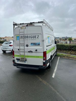 a white van that is parked in a parking lot