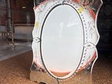 a picture of a mirror that is sitting on the floor