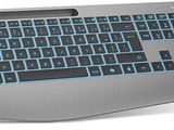 a computer keyboard and mouse on a white surface