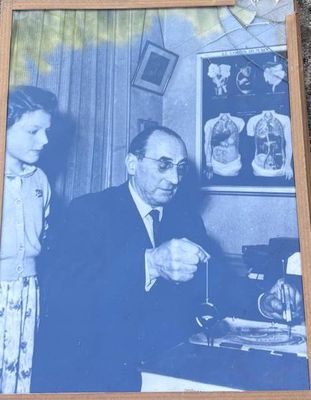 an old picture of a man and a little girl