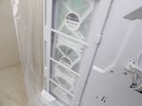 a small refrigerator with a lot of items inside of it