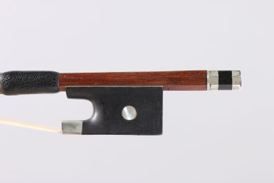 a close up of a violin bow on a white background