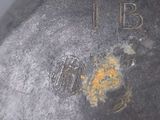 a close up of a metal object with a yellow substance on it