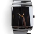 an image of a close up of a wrist watch on a white surface