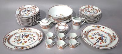 many plates and cups and saucers on the table