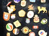 many different types of badges on a black surface