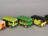 four toy trains that are lined up on the table