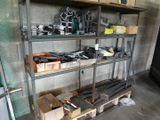 a shelf with many tools on it in a garage
