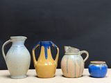 three vases sitting next to each other on a table