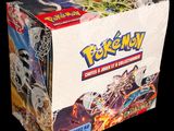 the box is full of pokemon cards on display on a black background
