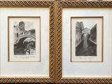 two framed pictures of a couple of buildings on the wall