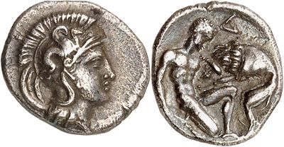 a silver coin with an image of a man and a woman on it