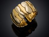 a close up of a gold ring on a black surface