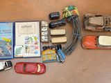a lot of toy cars and books on the floor