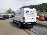 a white van that is parked in a parking lot