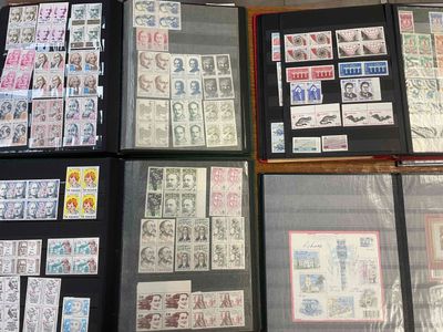 a lot of stamps on display in a display case