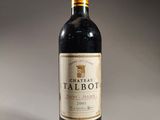 a bottle of wine that is sitting on a table