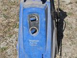 a blue machine that is sitting on the ground