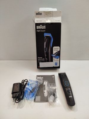 a box with a remote control and other items on the table