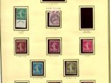 a framed picture of a collection of stamps with different colors