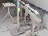 two tables that are sitting in the middle of a room