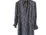 a black and white leopard print shirt on a hanger
