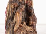 an image of a statue of a manger with a baby jesus and three other people