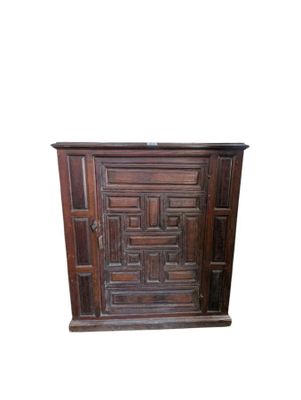 an image of a wooden cabinet with a door
