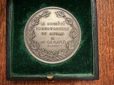 a close up of a medal in a box on a table