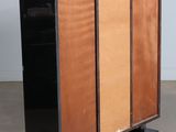 a cabinet that is made out of wood and has a black base