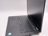 a laptop that is sitting on a white table