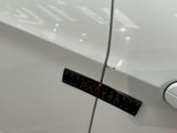 a sticker on the door of a white car