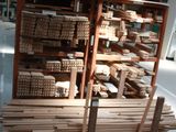 stacks of wood stacked on a pallet in a warehouse
