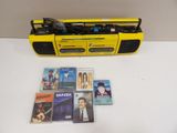 yellow cassette player with cd ' s, cassette recorder, and other cds