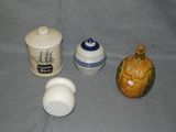 three different types of salt and pepper shakers on the table