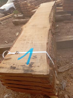 a large piece of wood with a blue arrow painted on it