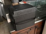 a black box sitting on top of a counter in a restaurant
