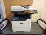 a printer that is sitting on top of a cart